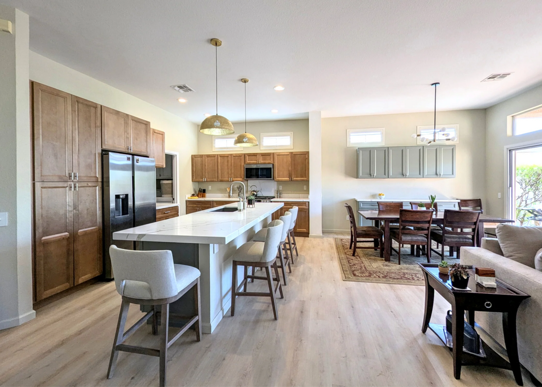 Natural wood kitchen cabinets with warm tones and neutral countertops in a modern home